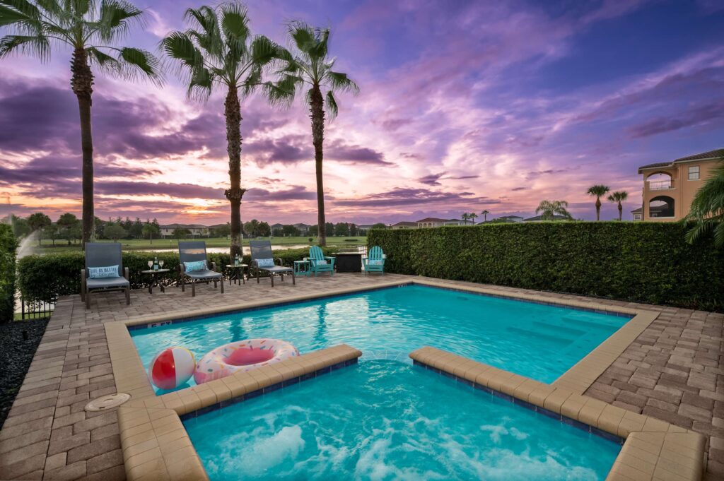 Tropical pool with sunset backdrop