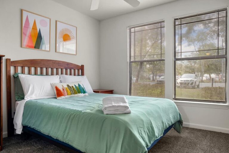 Lutz Florida homeowner reviewing Airbnb listing performance on a laptop, considering professional vacation rental management with Blue Gems Management in Hillsborough County
